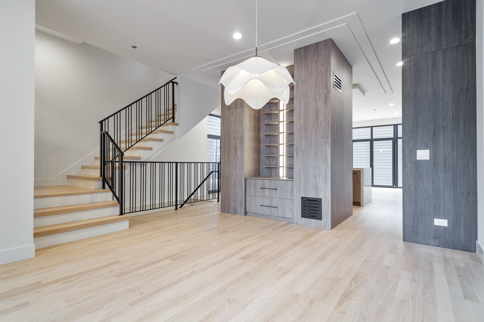 2055 West Race Avenue Chicago, IL 60612 - Photo 10 of 36 a view of a hallway with a chandelier