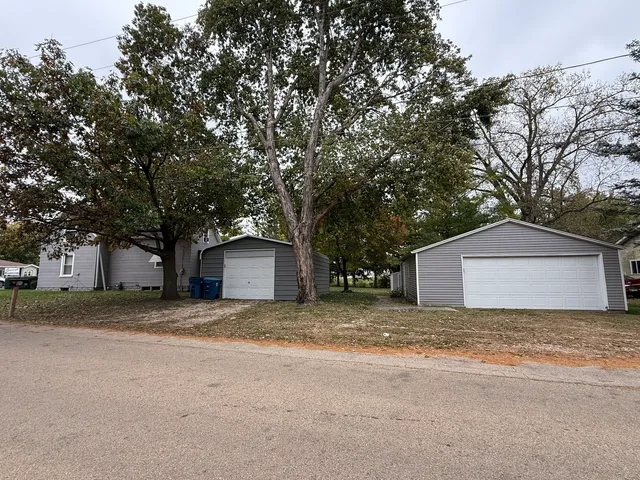 a house with a tree in front of it