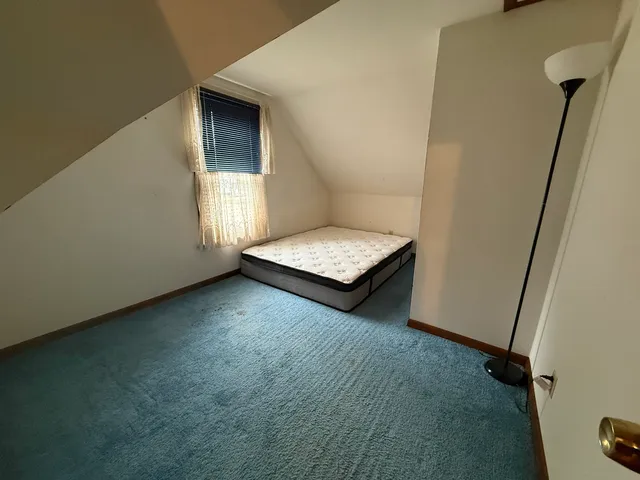 a view of room with window and stairs