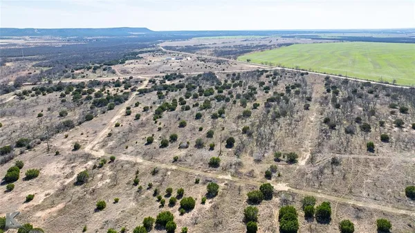 a view of a road with a yard