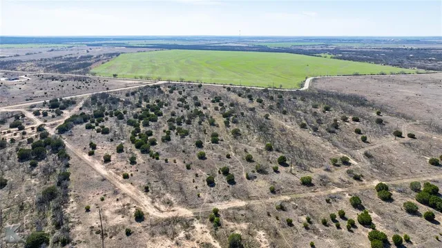 a view of a field with an outdoor space