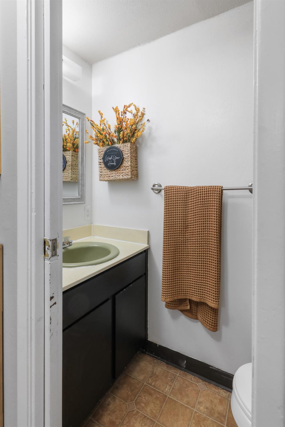 2402 West Turner Road Lodi, CA 95242 - Photo 13 of 14 a bathroom with a sink and a mirror
