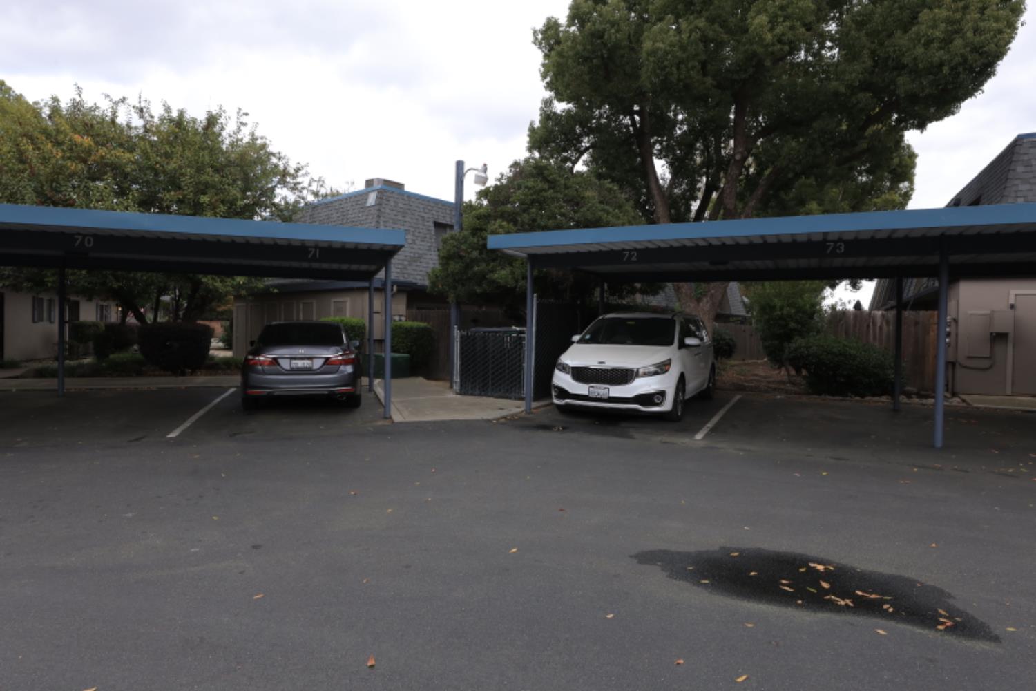 2402 West Turner Road Lodi, CA 95242 - Photo 14 of 14 a car parked in parking area next to a road
