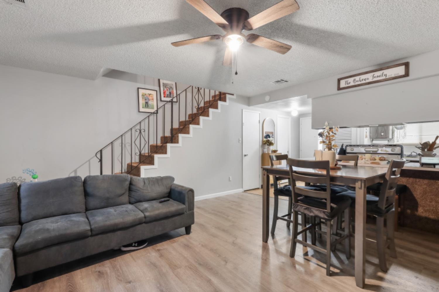 2402 West Turner Road Lodi, CA 95242 - Photo 4 of 14 a living room with furniture kitchen view and a chandelier