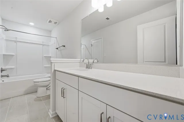 a bathroom with a sink a toilet and a bathtub