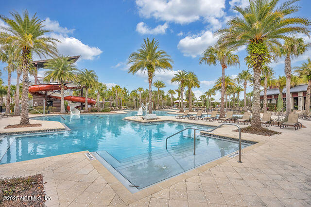 61 Spindrift Court St. Augustine, FL 32092 - Photo 1 of 61 a view of a swimming pool with lounge chairs