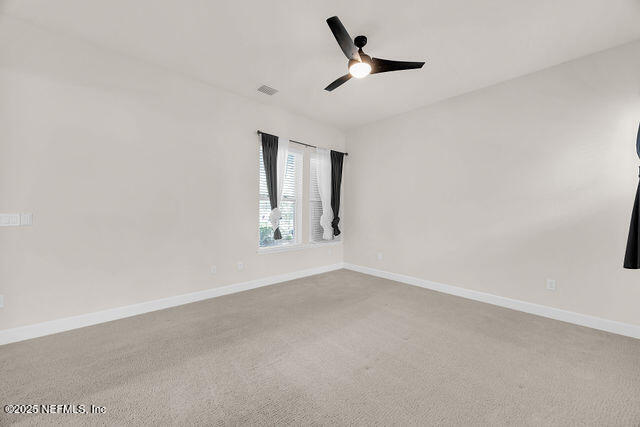 61 Spindrift Court St. Augustine, FL 32092 - Photo 14 of 61 an empty room with a empty space and windows