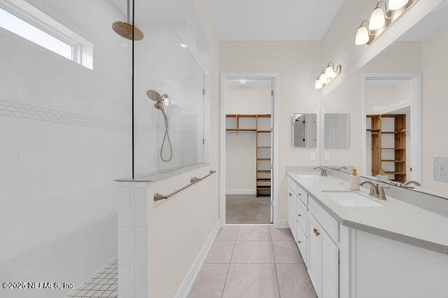 61 Spindrift Court St. Augustine, FL 32092 - Photo 16 of 61 a bathroom with a double vanity sink a mirror and shower