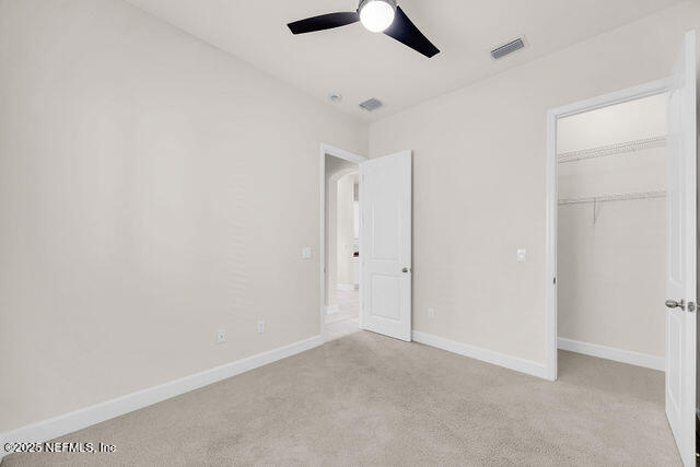 61 Spindrift Court St. Augustine, FL 32092 - Photo 23 of 61 an empty room with ceiling fan and window