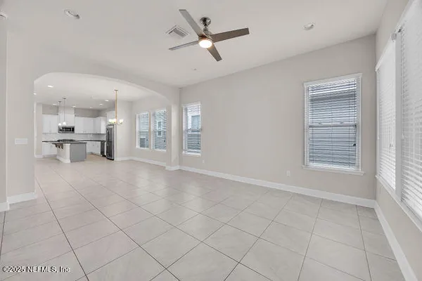 a living room with furniture and windows