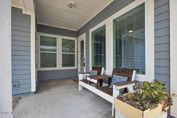 an aerial view of a house with a lake view
