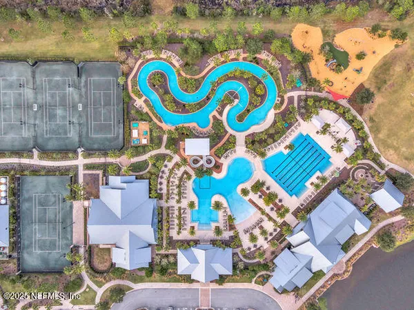 a view of swimming pool with outdoor seating and city view