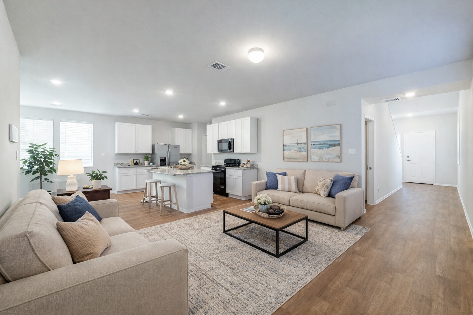 a living room with furniture white walls and white walls