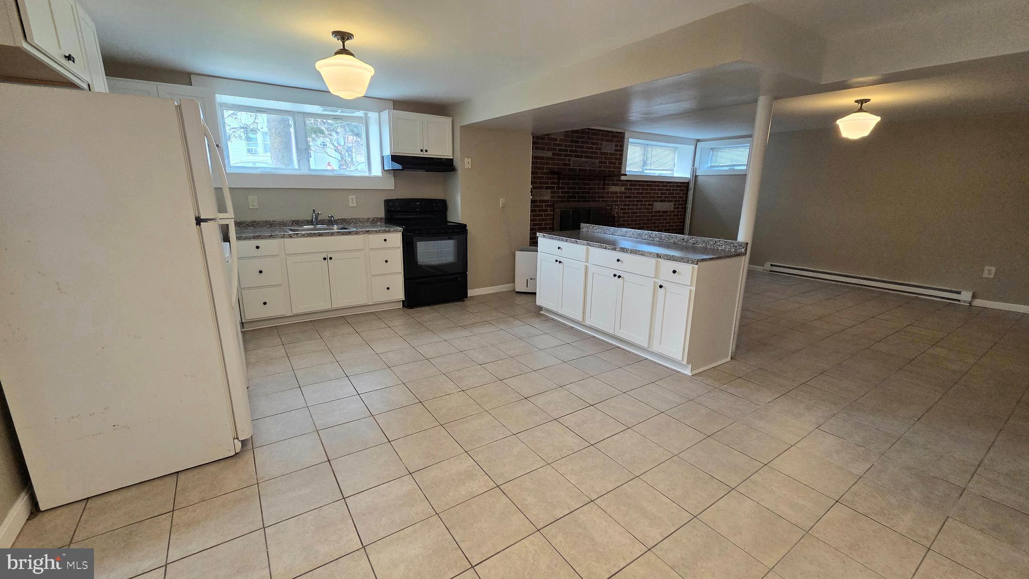 4400 4th Street Baltimore, MD 21225 - Photo 6 of 25 a kitchen with stainless steel appliances a cabinets and window