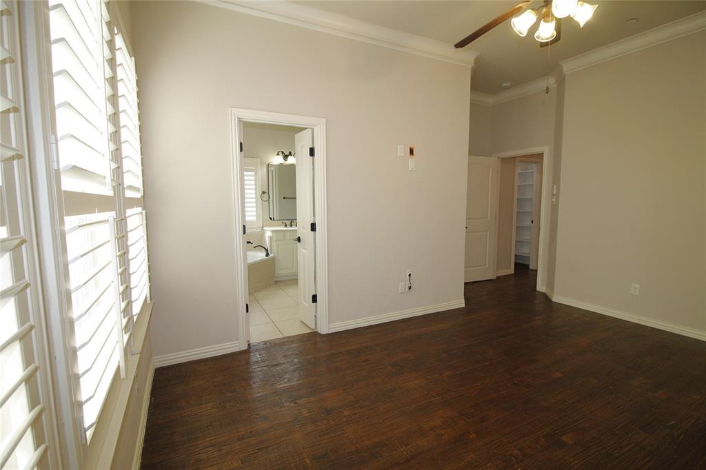 528 Tuscan Drive Irving, TX 75039 - Photo 17 of 40 a view of an empty room with wooden floor and a window