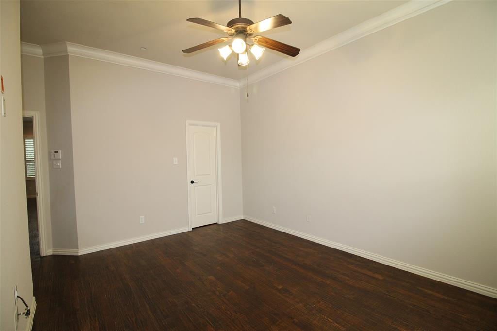 528 Tuscan Drive Irving, TX 75039 - Photo 19 of 40 a view of a room with a fan and a fan