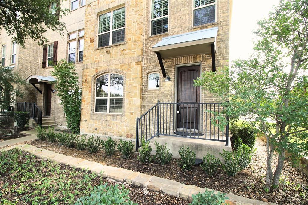 528 Tuscan Drive Irving, TX 75039 - Photo 2 of 40 a front view of a house with a garden
