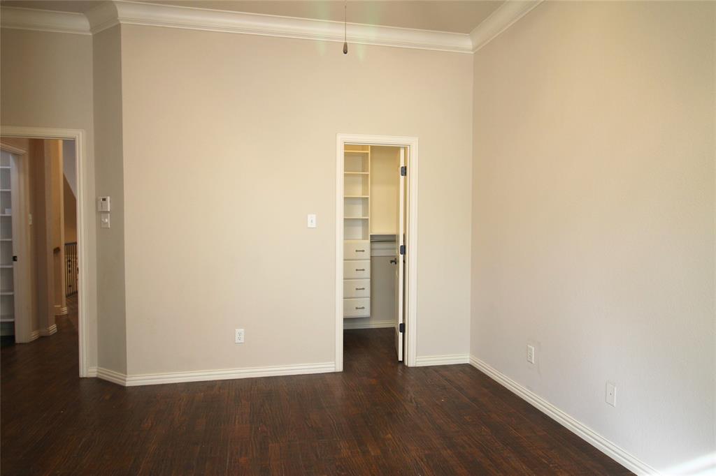 528 Tuscan Drive Irving, TX 75039 - Photo 21 of 40 a view of an empty room with wooden floor and closet