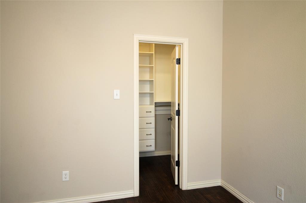 528 Tuscan Drive Irving, TX 75039 - Photo 22 of 40 Hall with baseboards and dark wood-type flooring