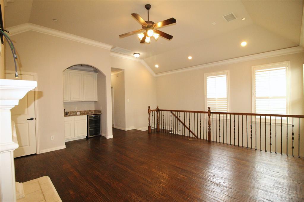 528 Tuscan Drive Irving, TX 75039 - Photo 30 of 40 a view of a livingroom with furniture a ceiling fan and wooden floor
