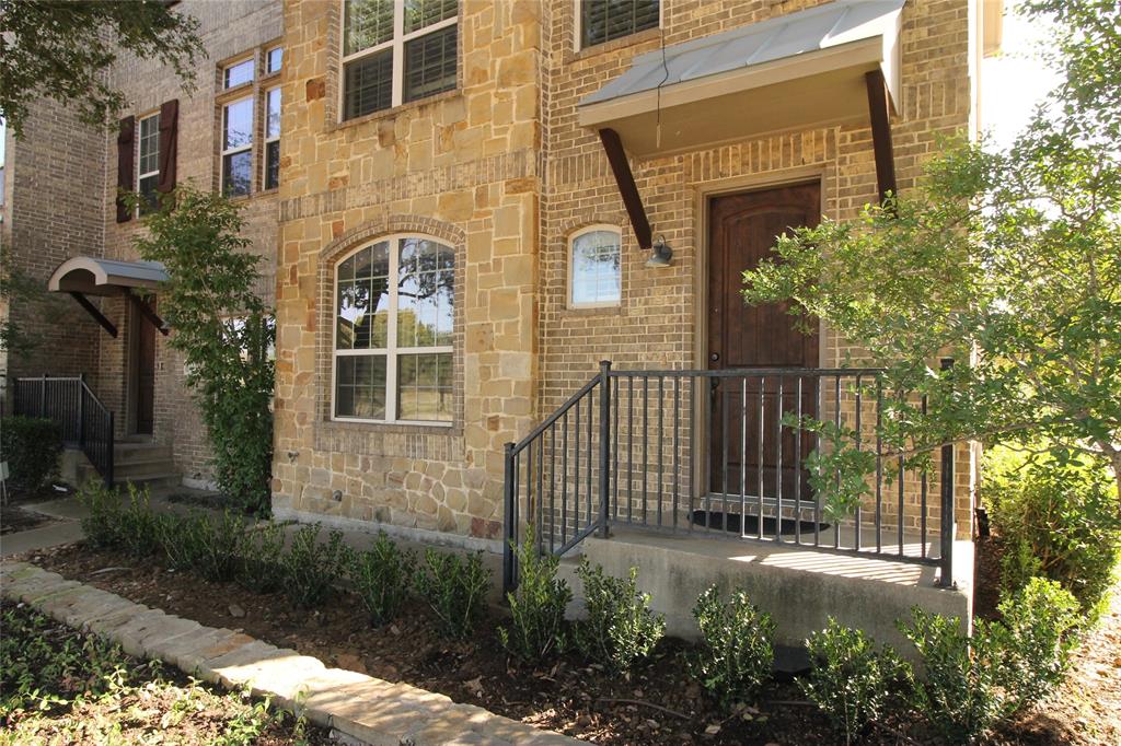 528 Tuscan Drive Irving, TX 75039 - Photo 40 of 40 Property entrance with stone siding and brick siding