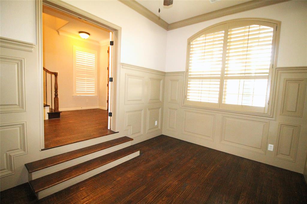 528 Tuscan Drive Irving, TX 75039 - Photo 6 of 40 a view of an empty room with wooden floor and a window