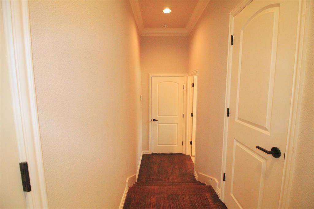 528 Tuscan Drive Irving, TX 75039 - Photo 7 of 40 a view of a hallway with wooden floor