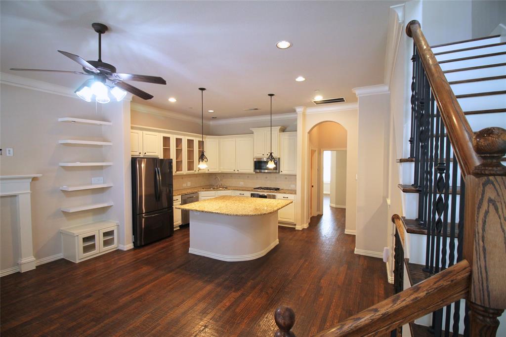 528 Tuscan Drive Irving, TX 75039 - Photo 9 of 40 a view of a kitchen with a sink and dishwasher with wooden floor