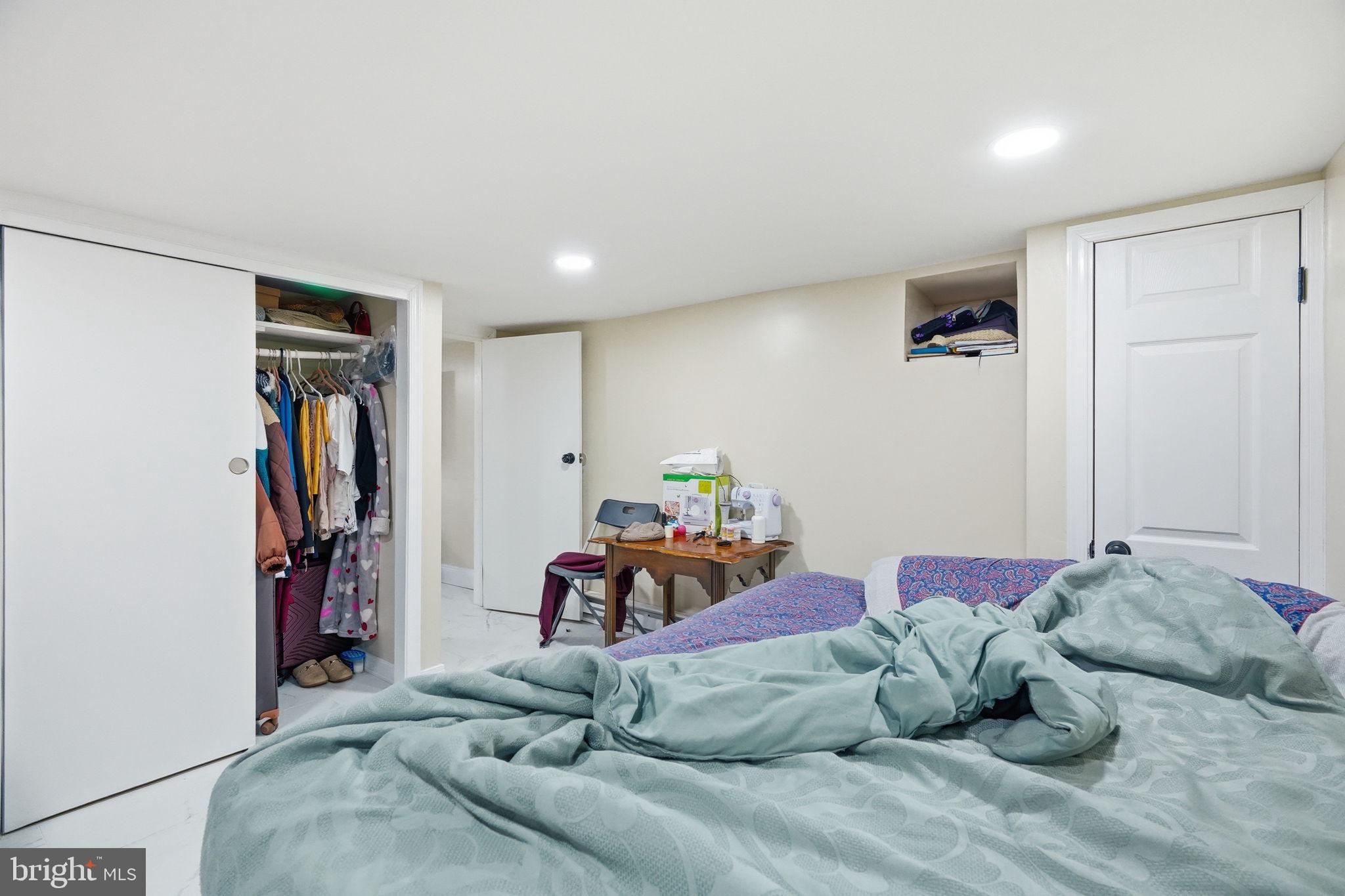 108 New Holland Avenue Reading, PA 19607 - Photo 21 of 66 a bedroom with a bed and a walk in closet