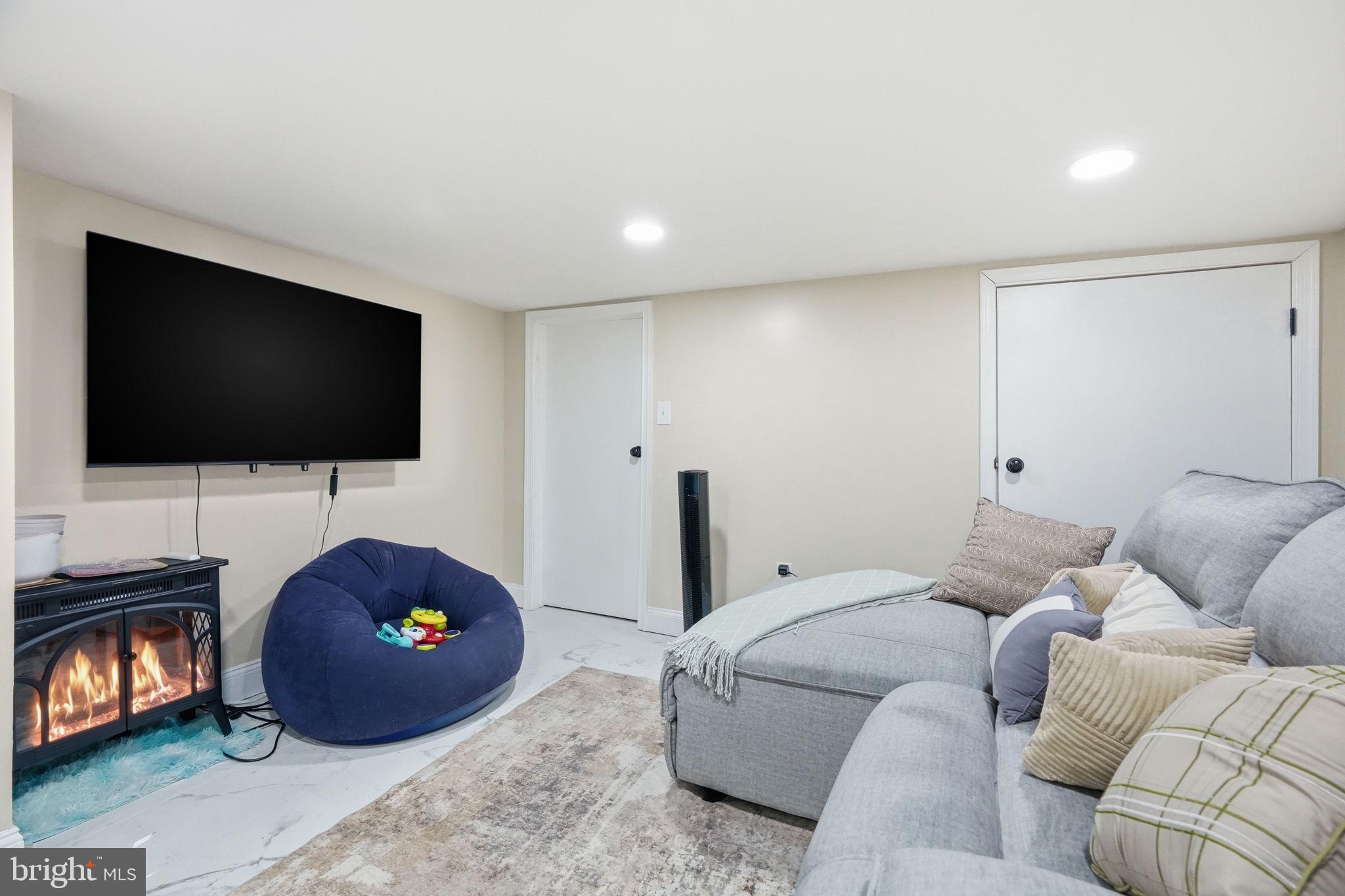 108 New Holland Avenue Reading, PA 19607 - Photo 23 of 66 a living room with a flat screen tv and a couch