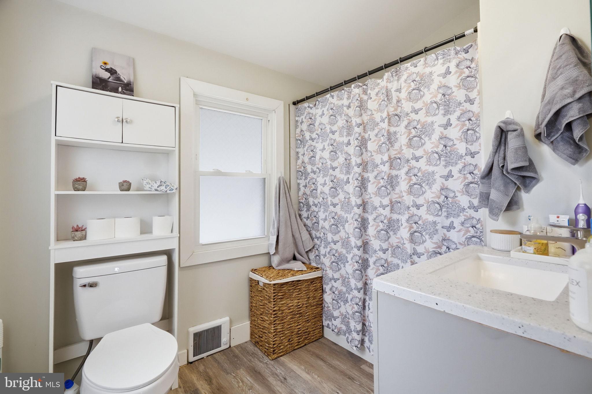 108 New Holland Avenue Reading, PA 19607 - Photo 28 of 66 a bathroom with a granite countertop toilet sink and mirror