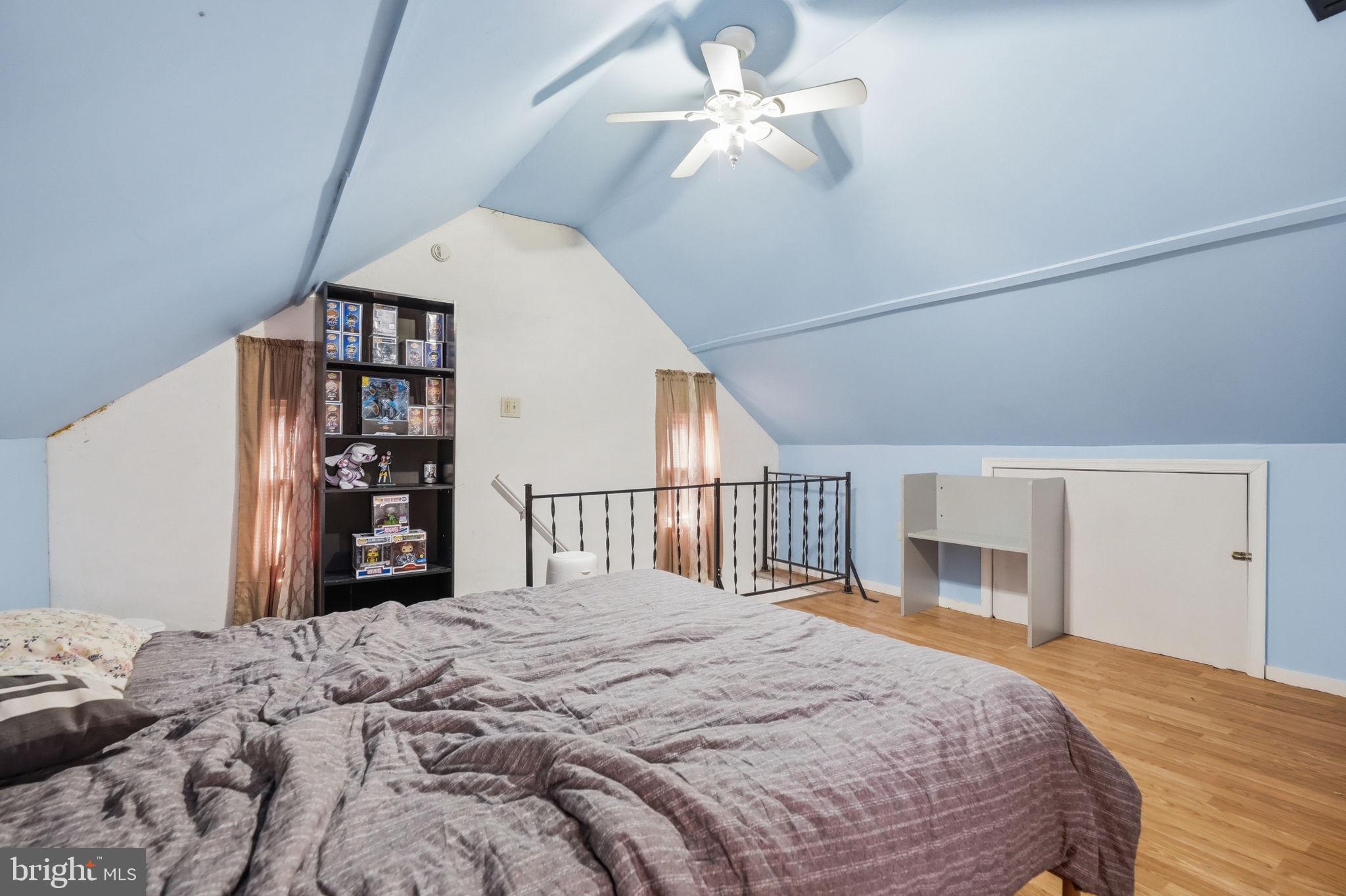 108 New Holland Avenue Reading, PA 19607 - Photo 37 of 66 a bedroom with a large bed and a chandelier
