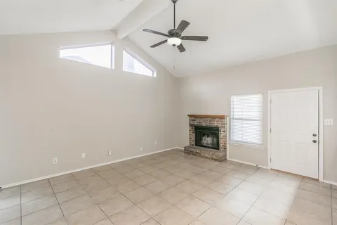a view of an empty room with a fireplace