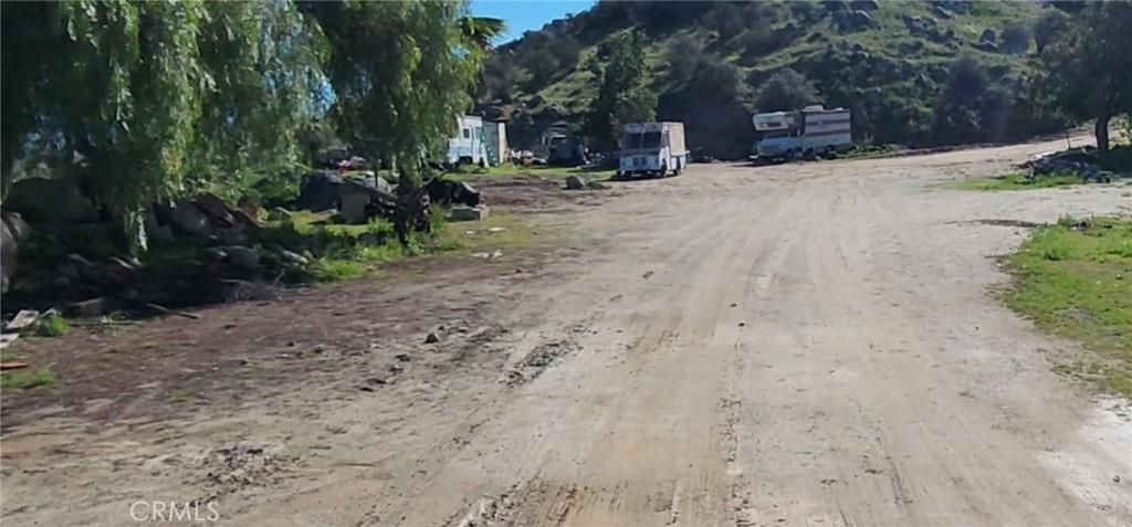 23250 El Nido Road Perris, CA 92570 - Photo 11 of 23 a view of road with trees