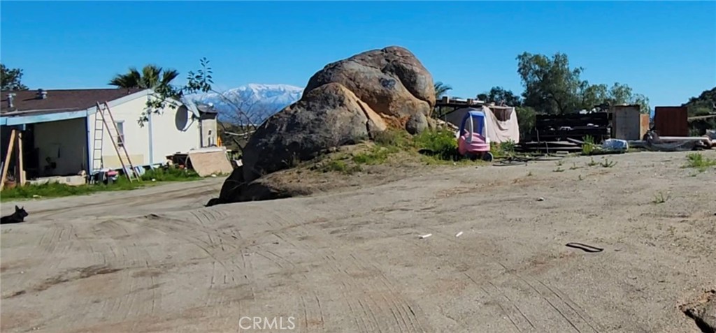 23250 El Nido Road Perris, CA 92570 - Photo 13 of 23 a backyard of a house with barbeque oven table and chairs