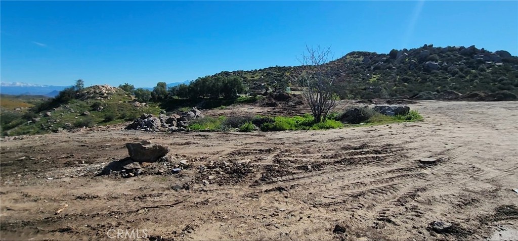 23250 El Nido Road Perris, CA 92570 - Photo 18 of 23 a view of a yard with a tree in the background