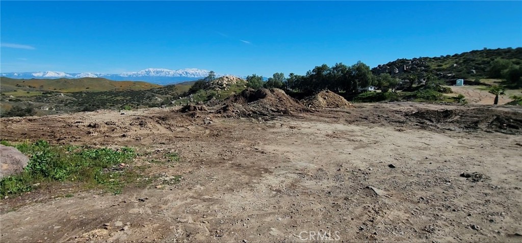 23250 El Nido Road Perris, CA 92570 - Photo 20 of 23 a view of a dry yard with mountains in the background