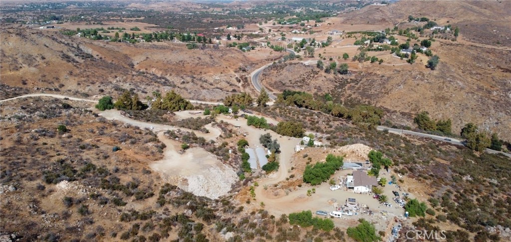 23250 El Nido Road Perris, CA 92570 - Photo 3 of 23 a view of a yard with wooden fence