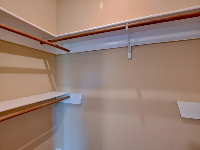 a view of a room with racks on the wall