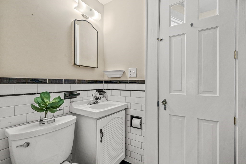 36 Laurel Avenue Wellesley, MA 02481 - Photo 12 of 27 a bathroom with a sink and a mirror