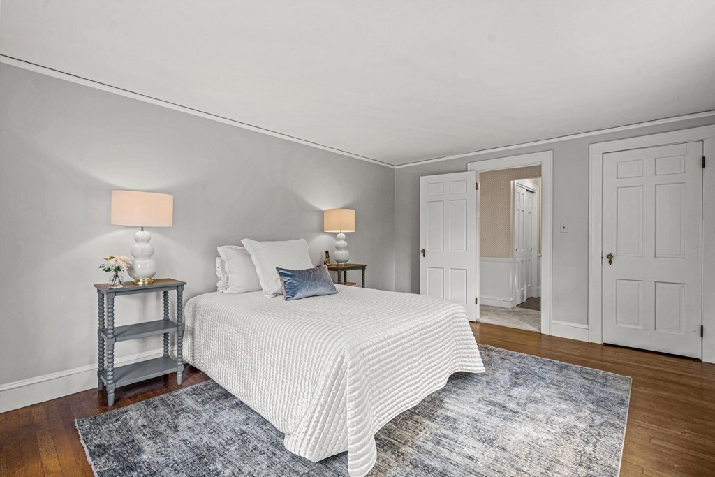 36 Laurel Avenue Wellesley, MA 02481 - Photo 15 of 27 a bedroom with a bed and a couch