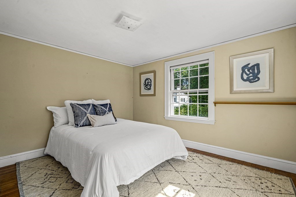 36 Laurel Avenue Wellesley, MA 02481 - Photo 17 of 27 a bedroom with a bed and a window