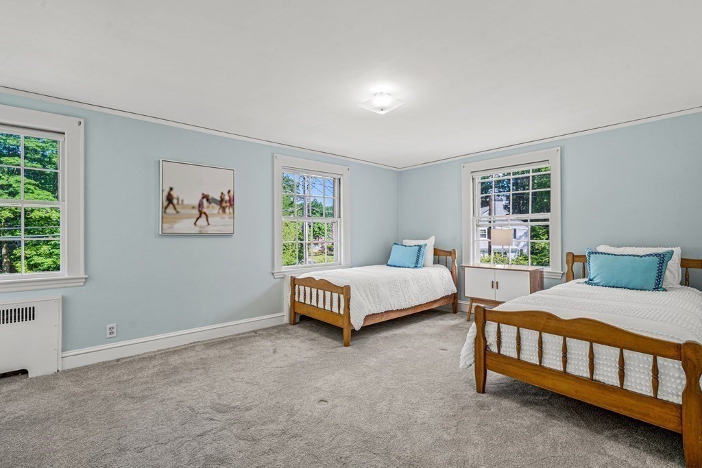 36 Laurel Avenue Wellesley, MA 02481 - Photo 20 of 27 a bedroom with a bed and a window