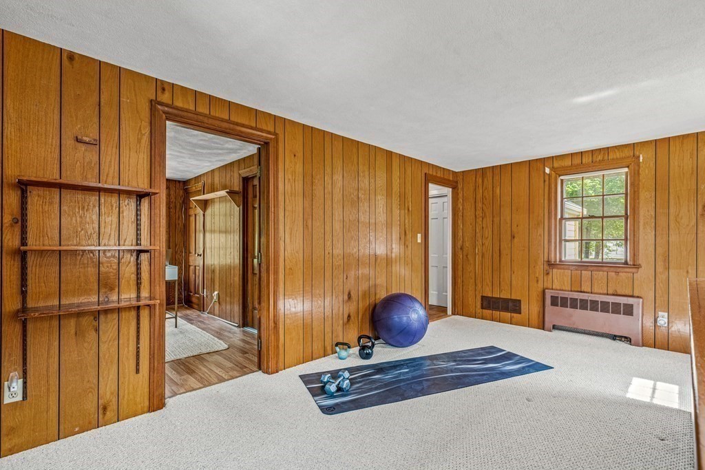 36 Laurel Avenue Wellesley, MA 02481 - Photo 21 of 27 a bedroom with furniture and a window