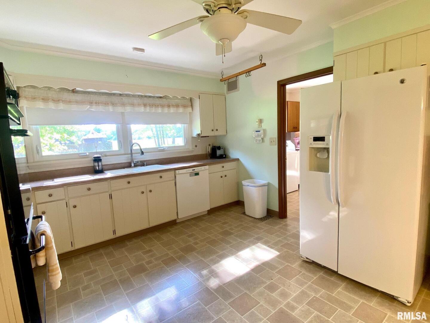 807 West Market Street Christopher, IL 62822 - Photo 11 of 57 a room with a refrigerator and a sink