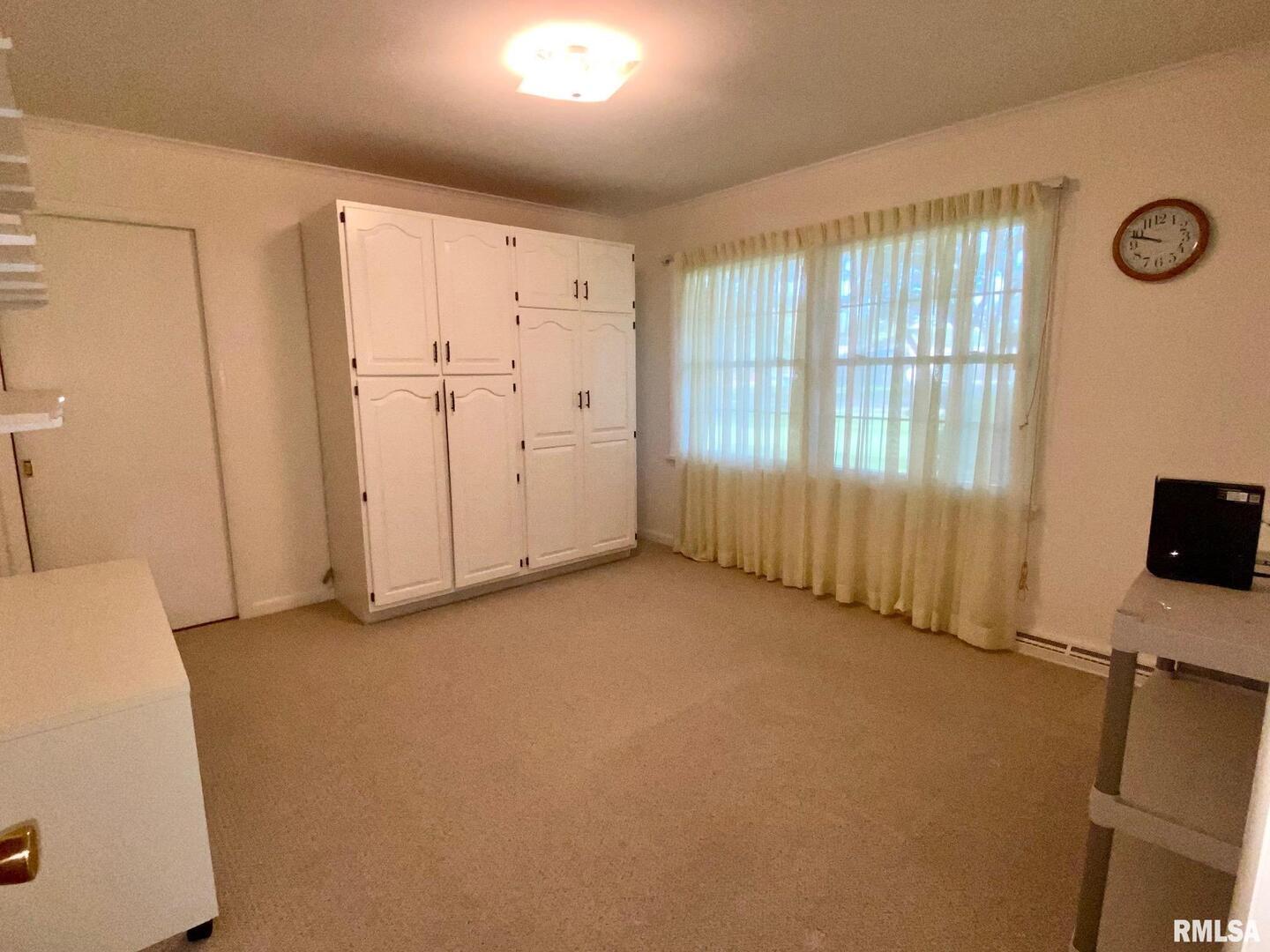 807 West Market Street Christopher, IL 62822 - Photo 16 of 57 a view of an empty room with a window