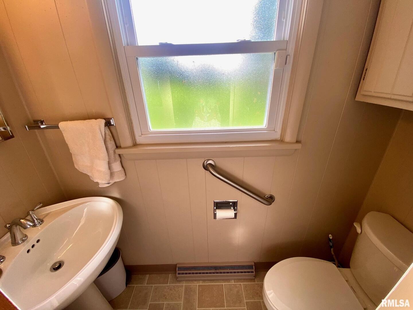 807 West Market Street Christopher, IL 62822 - Photo 17 of 57 a bathroom with a toilet sink and mirror