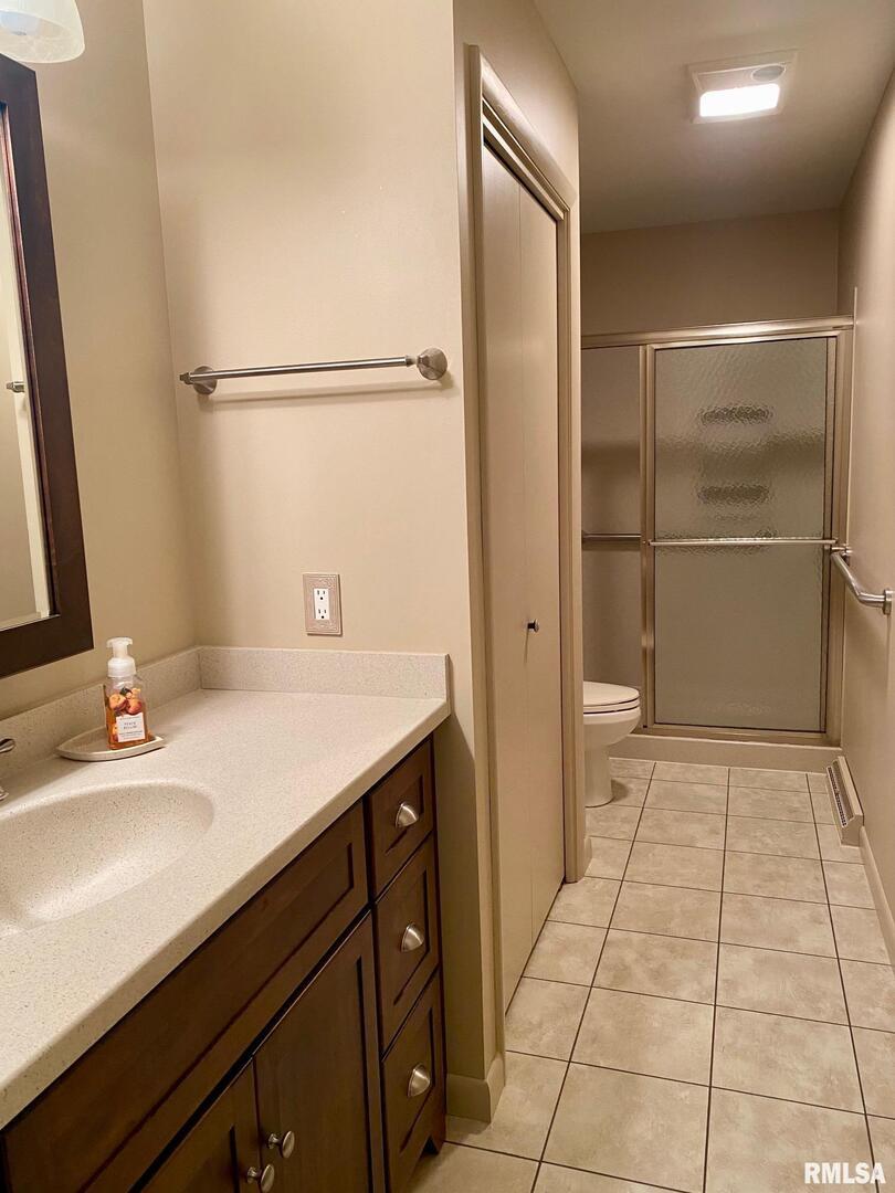 807 West Market Street Christopher, IL 62822 - Photo 19 of 57 a bathroom with a sink a toilet and a mirror