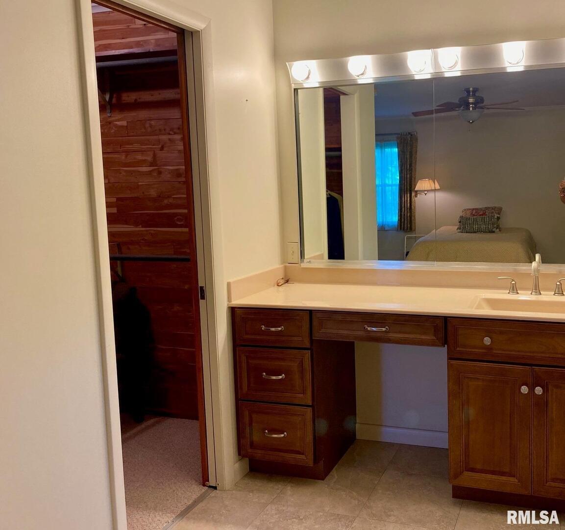 807 West Market Street Christopher, IL 62822 - Photo 25 of 57 a bathroom with a sink and a mirror