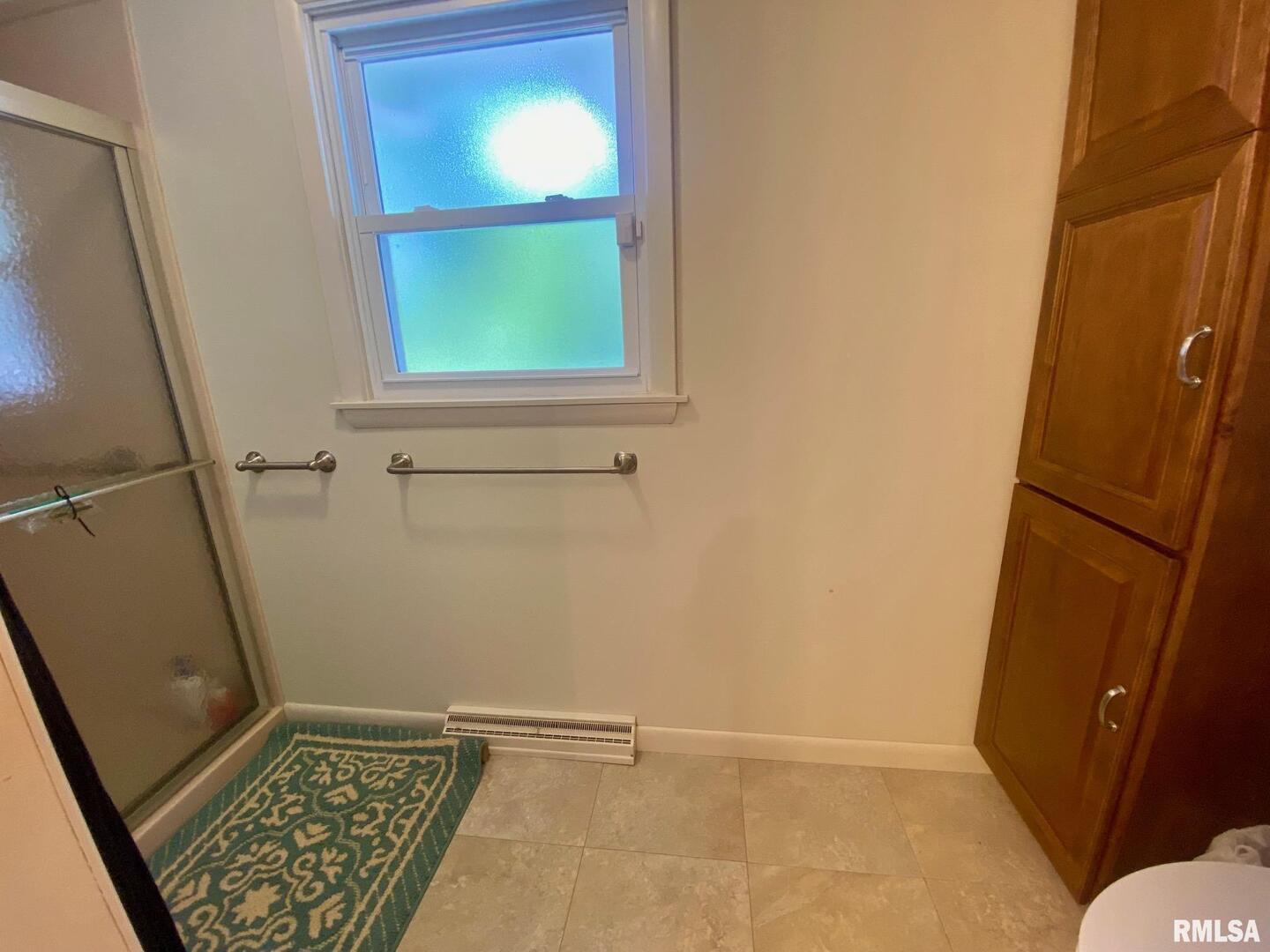 807 West Market Street Christopher, IL 62822 - Photo 26 of 57 a view of an empty room with a window and a rug